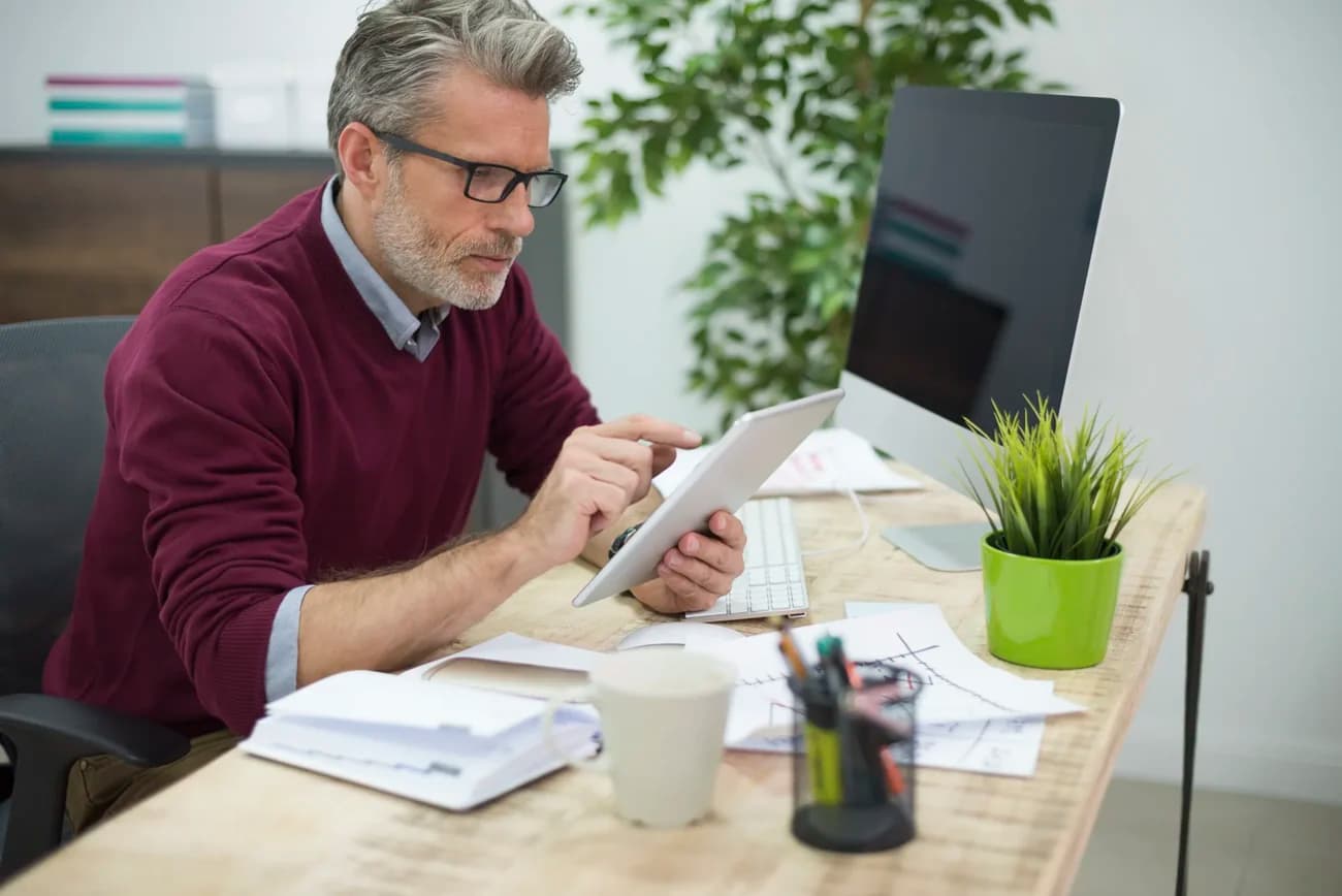 Micron Technology employee reviewing RSU vesting tax documents at desk in Boise Idaho